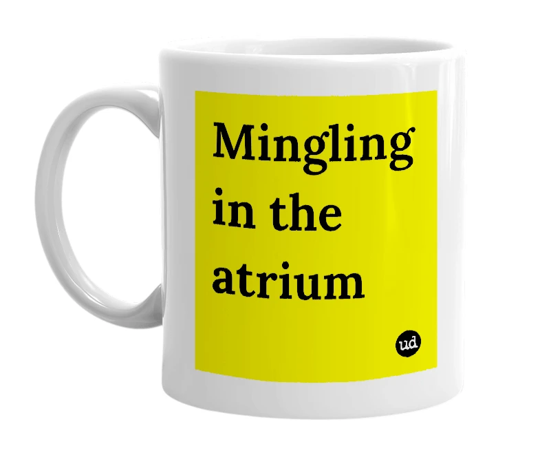 White mug with 'Mingling in the atrium' in bold black letters
