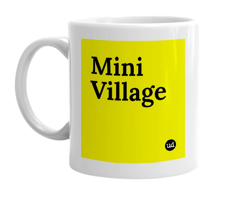 White mug with 'Mini Village' in bold black letters