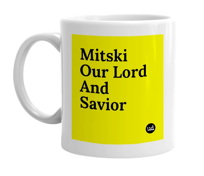 White mug with 'Mitski Our Lord And Savior' in bold black letters