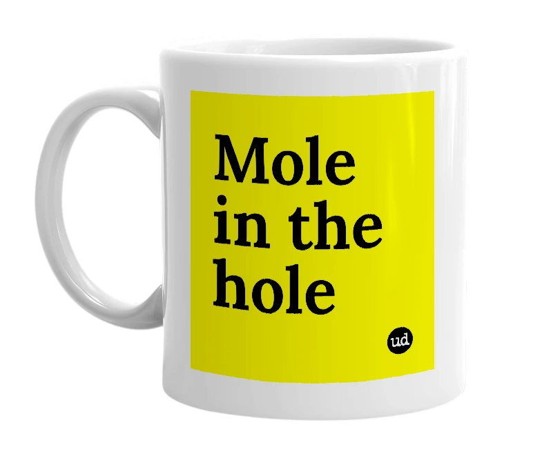 White mug with 'Mole in the hole' in bold black letters