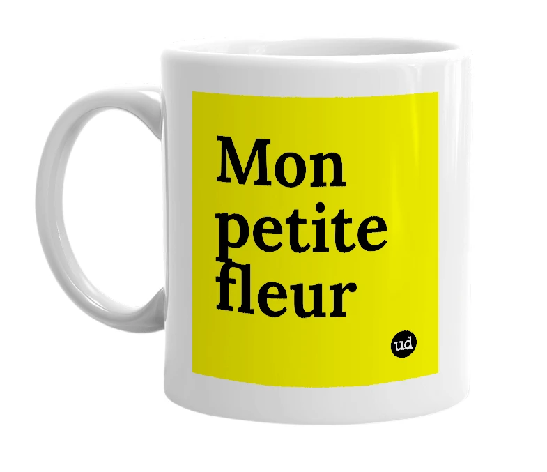 White mug with 'Mon petite fleur' in bold black letters