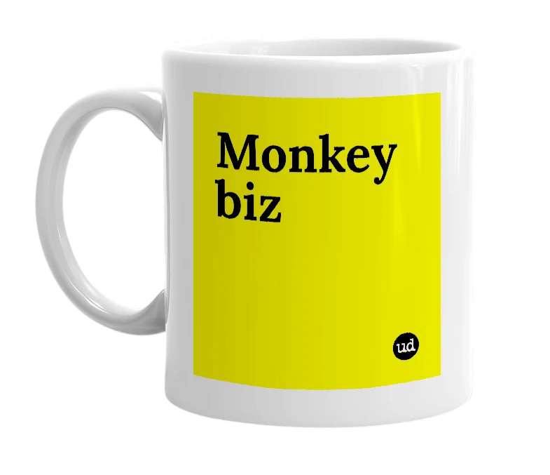 White mug with 'Monkey biz' in bold black letters
