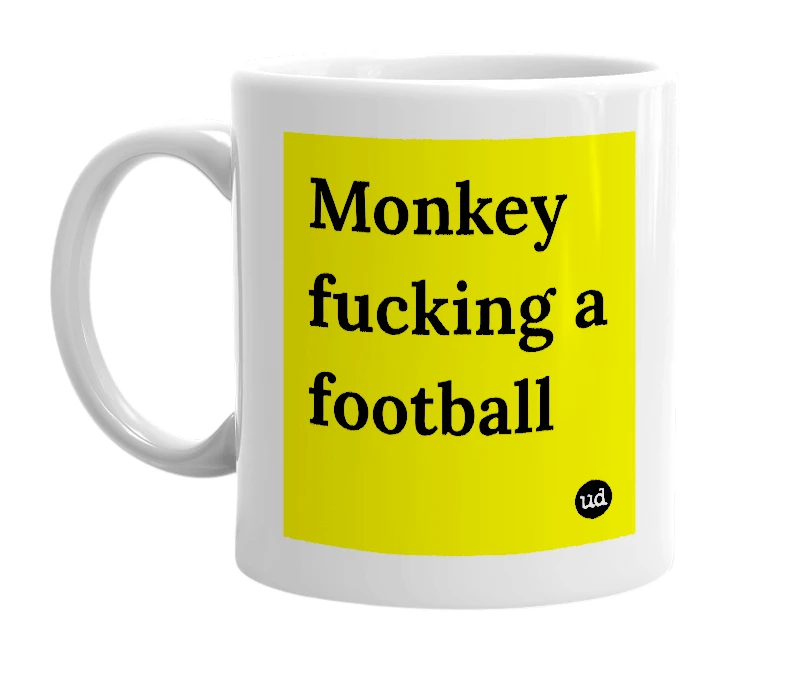 White mug with 'Monkey fucking a football' in bold black letters