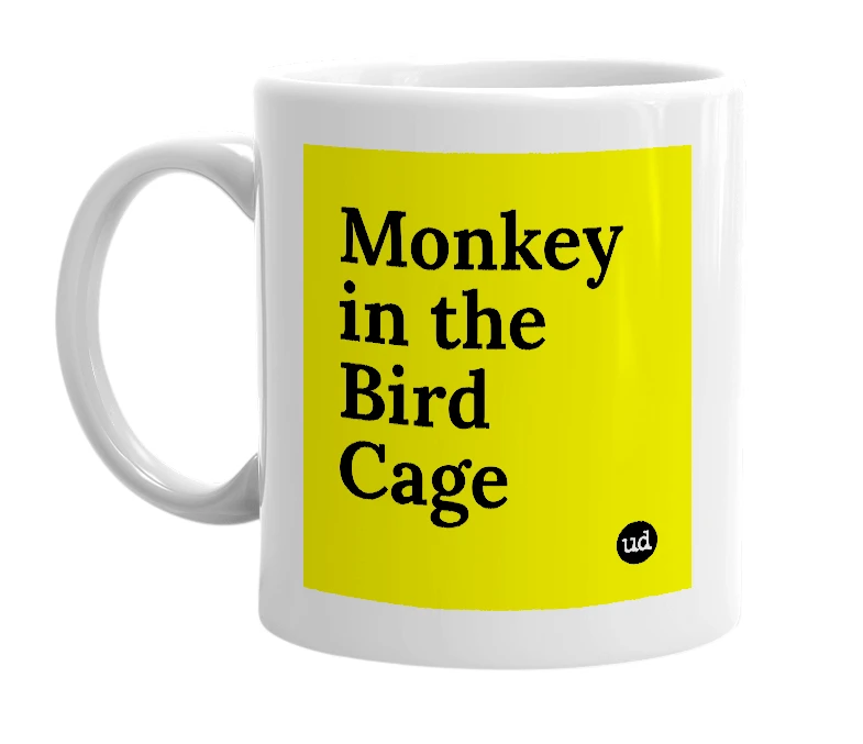 White mug with 'Monkey in the Bird Cage' in bold black letters