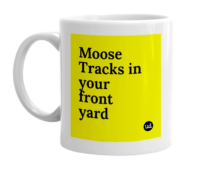 White mug with 'Moose Tracks in your front yard' in bold black letters