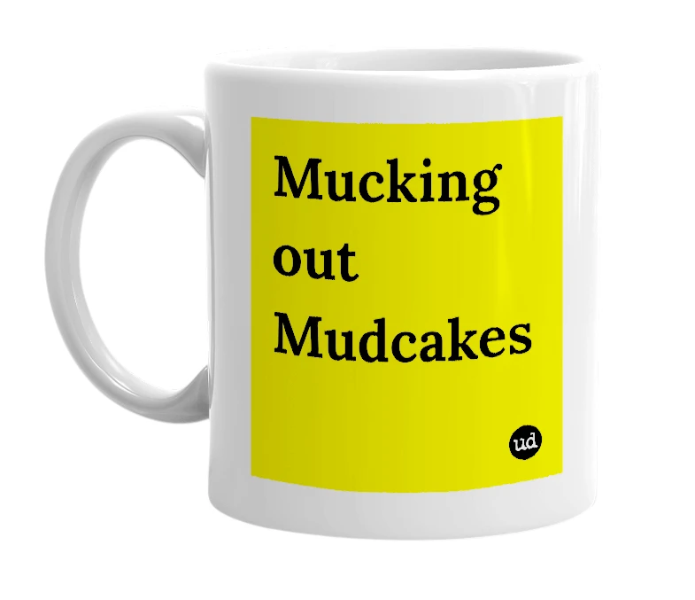 White mug with 'Mucking out Mudcakes' in bold black letters