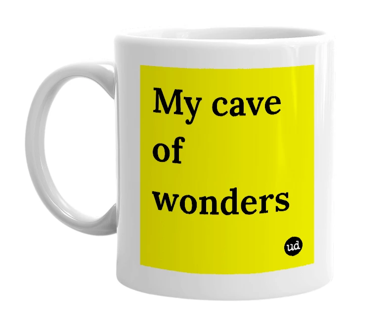 White mug with 'My cave of wonders' in bold black letters