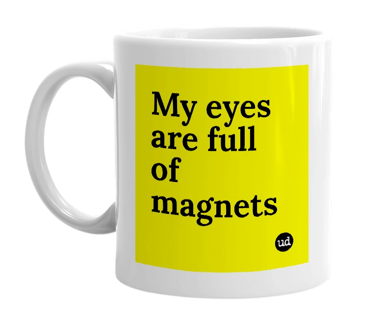 White mug with 'My eyes are full of magnets' in bold black letters