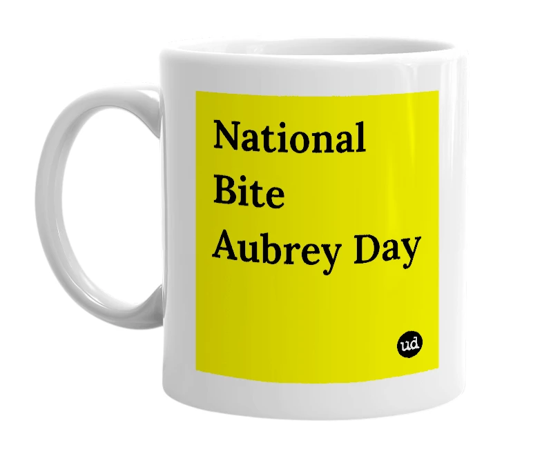 White mug with 'National Bite Aubrey Day' in bold black letters