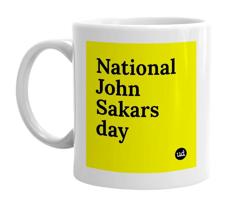 White mug with 'National John Sakars day' in bold black letters