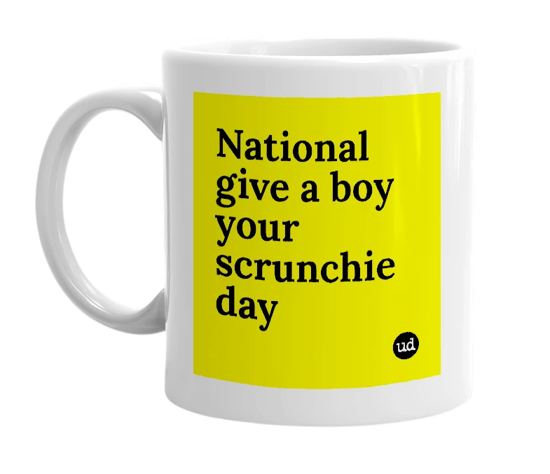 White mug with 'National give a boy your scrunchie day' in bold black letters