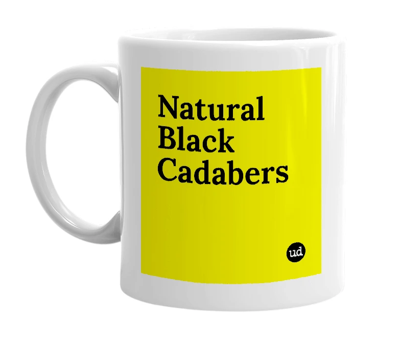 White mug with 'Natural Black Cadabers' in bold black letters