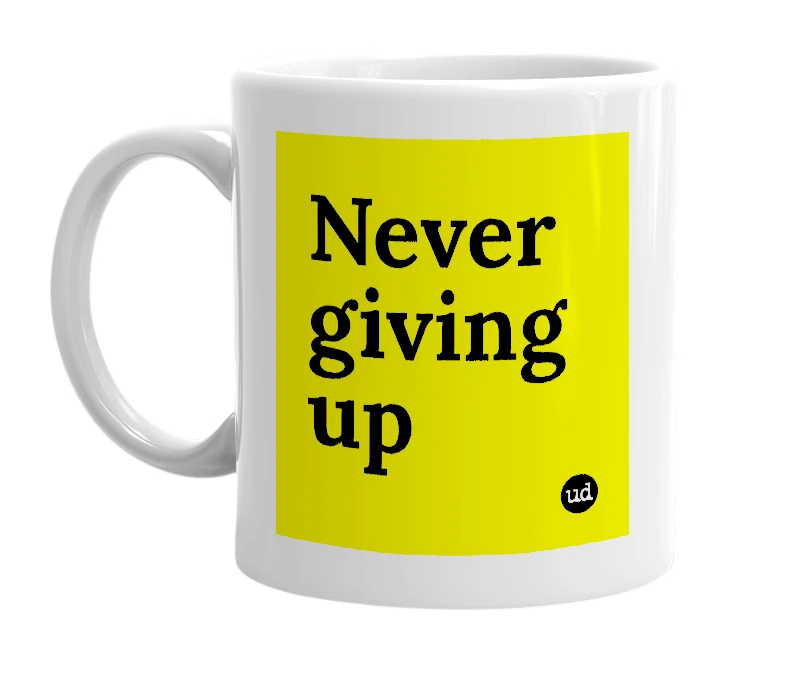 White mug with 'Never giving up' in bold black letters