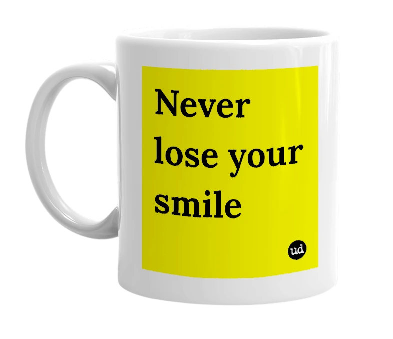 White mug with 'Never lose your smile' in bold black letters