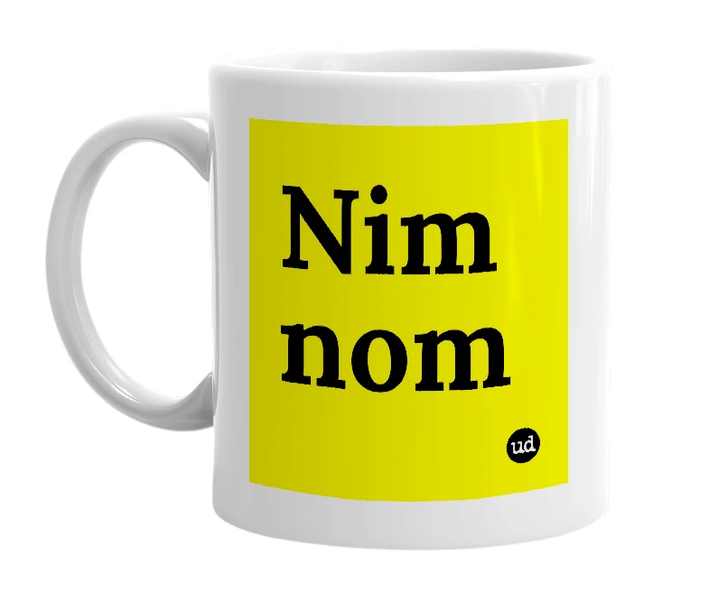 White mug with 'Nim nom' in bold black letters