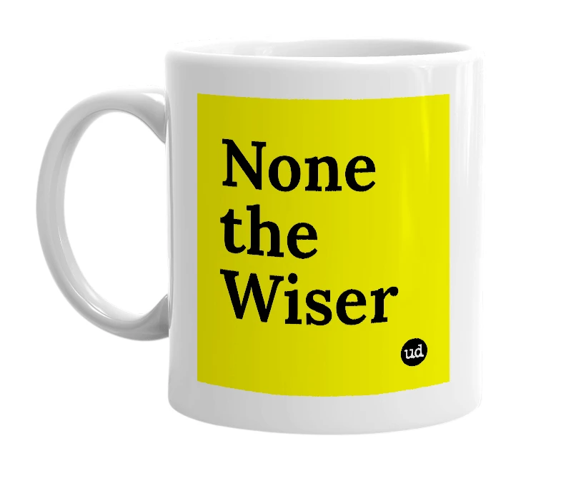 White mug with 'None the Wiser' in bold black letters