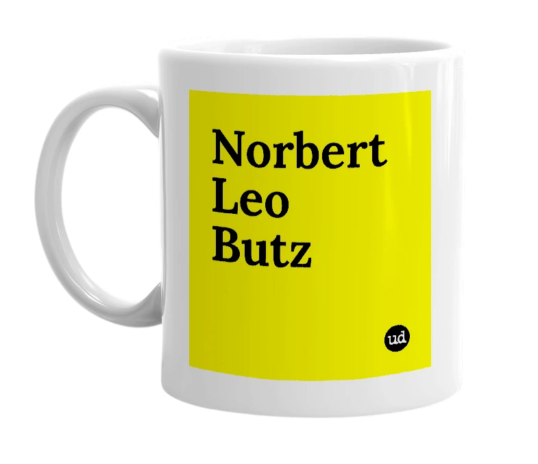 White mug with 'Norbert Leo Butz' in bold black letters