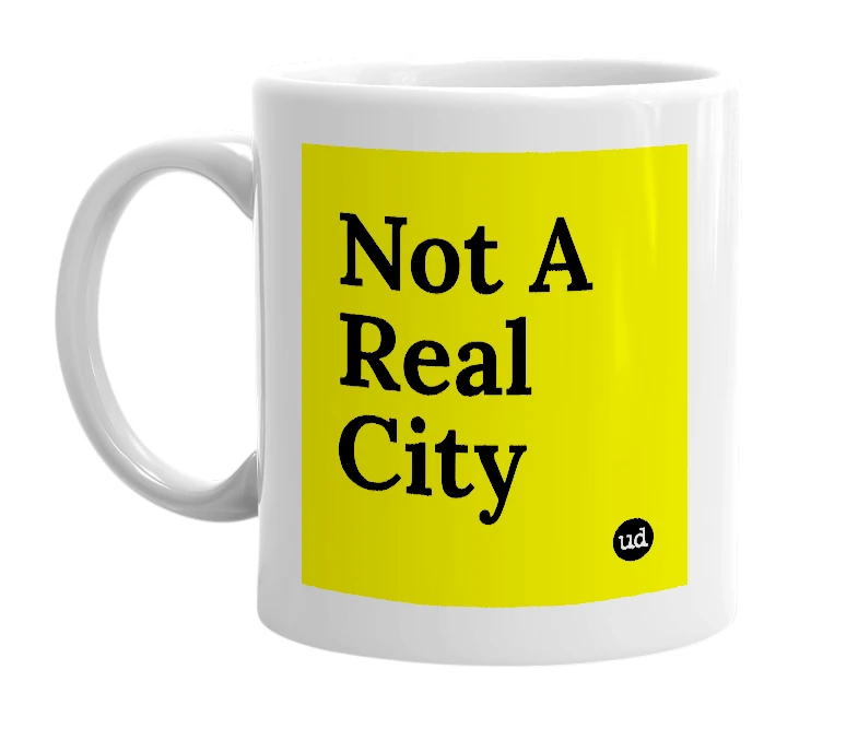 White mug with 'Not A Real City' in bold black letters