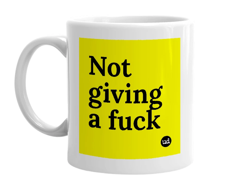 White mug with 'Not giving a fuck' in bold black letters