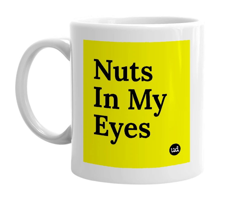 White mug with 'Nuts In My Eyes' in bold black letters