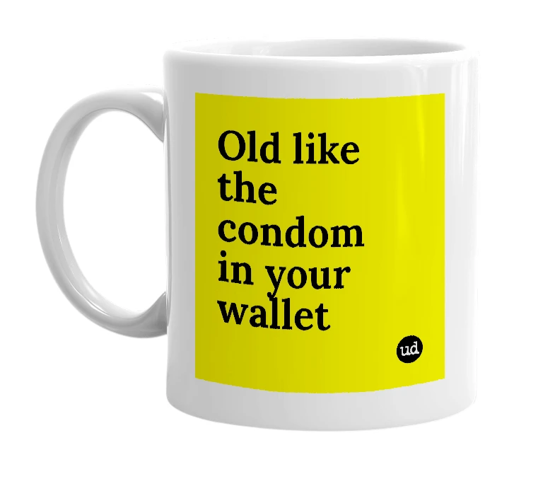 White mug with 'Old like the condom in your wallet' in bold black letters