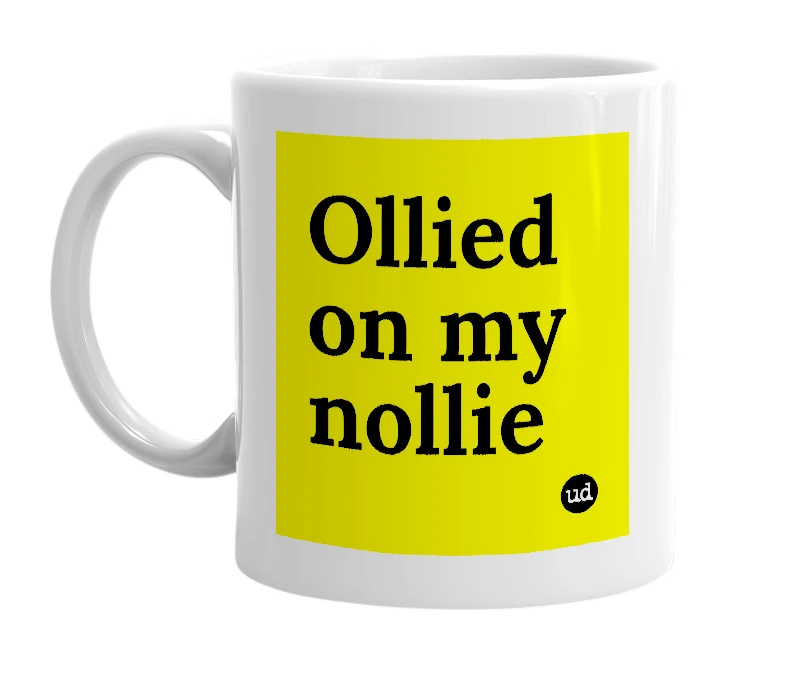 White mug with 'Ollied on my nollie' in bold black letters