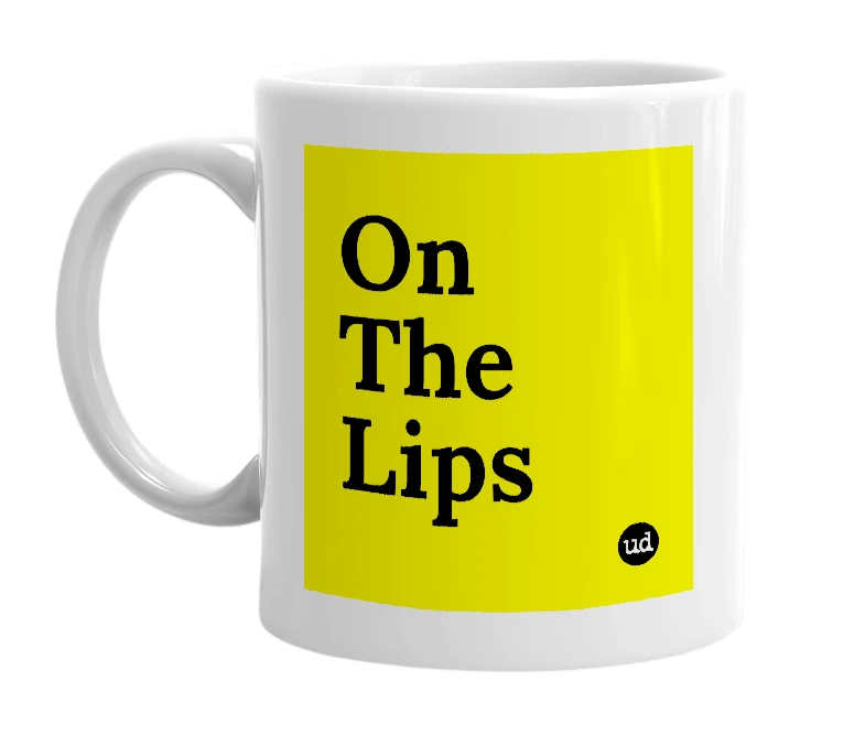 White mug with 'On The Lips' in bold black letters