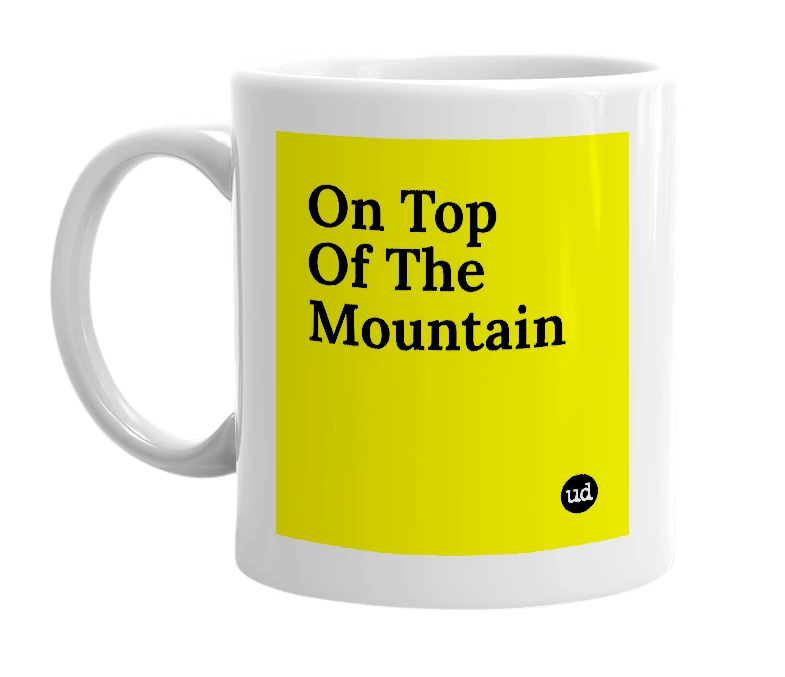 White mug with 'On Top Of The Mountain' in bold black letters