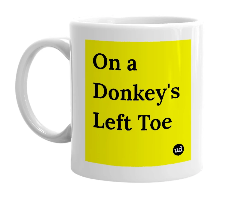 White mug with 'On a Donkey's Left Toe' in bold black letters