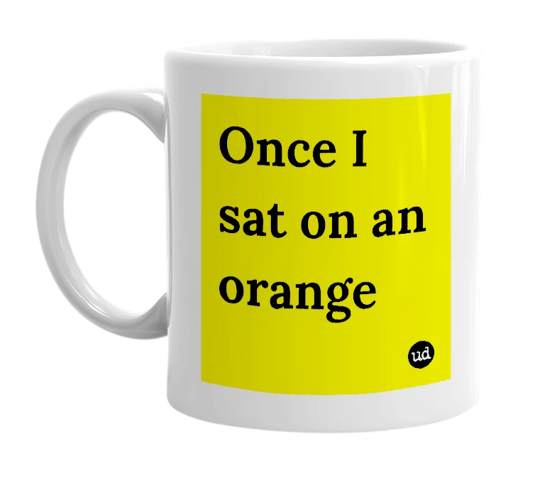 White mug with 'Once I sat on an orange' in bold black letters