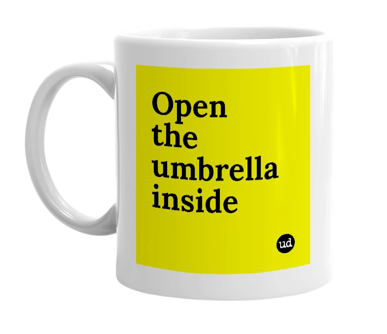 White mug with 'Open the umbrella inside' in bold black letters