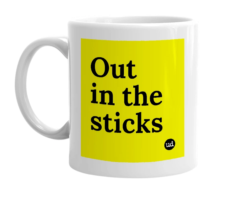 White mug with 'Out in the sticks' in bold black letters