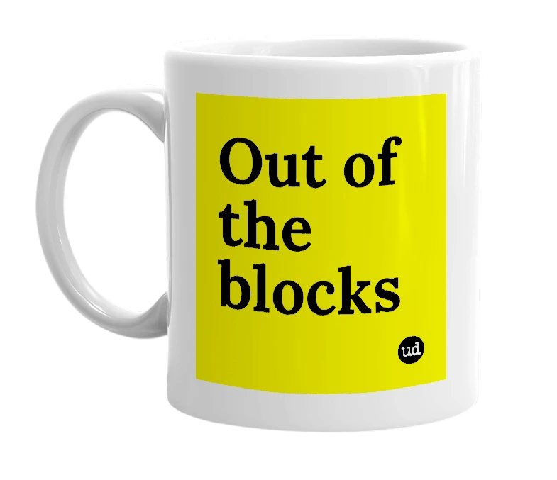 White mug with 'Out of the blocks' in bold black letters