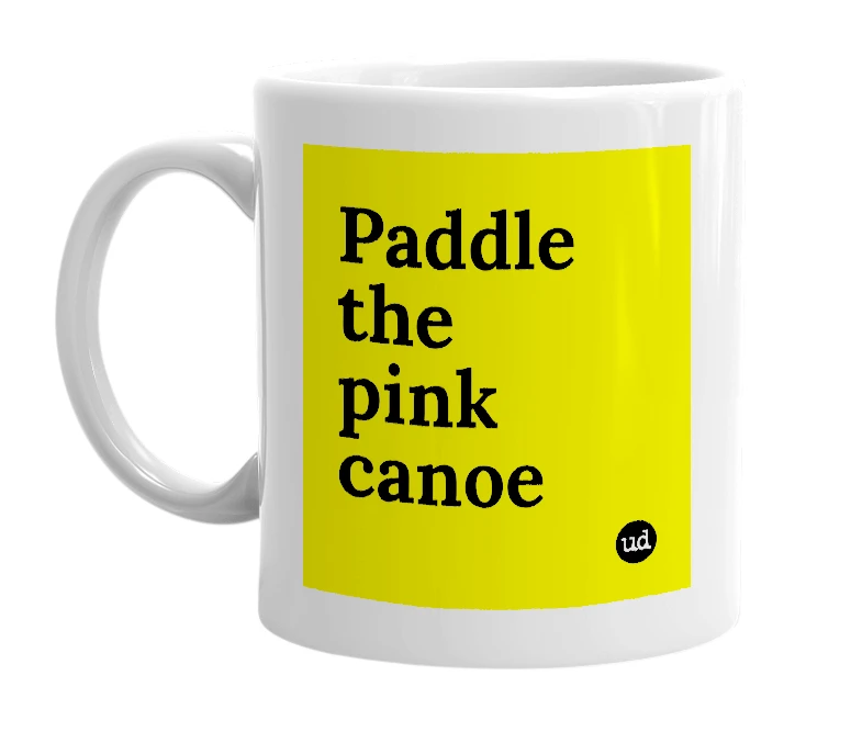 White mug with 'Paddle the pink canoe' in bold black letters