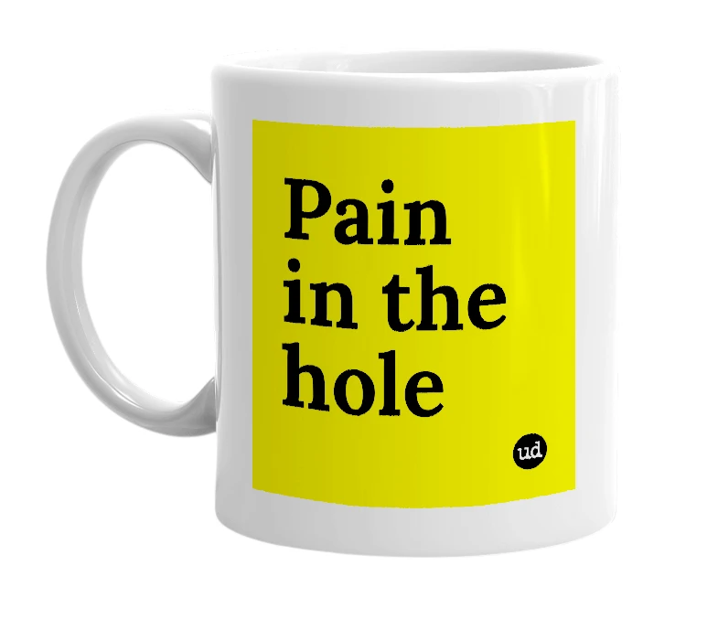 White mug with 'Pain in the hole' in bold black letters