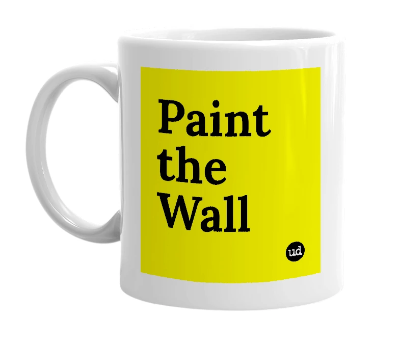 White mug with 'Paint the Wall' in bold black letters
