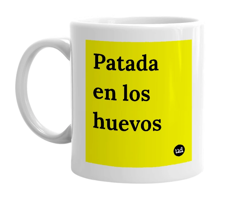 White mug with 'Patada en los huevos' in bold black letters