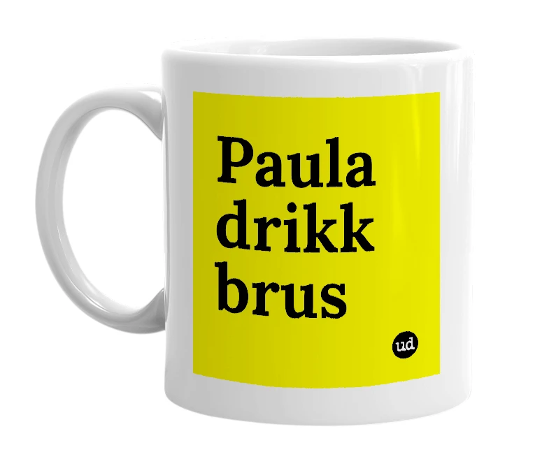 White mug with 'Paula drikk brus' in bold black letters