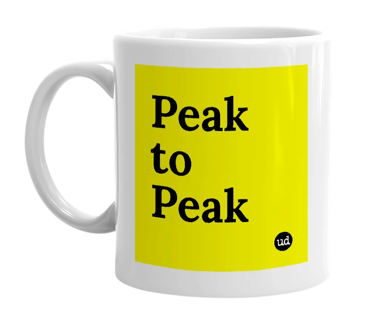 White mug with 'Peak to Peak' in bold black letters