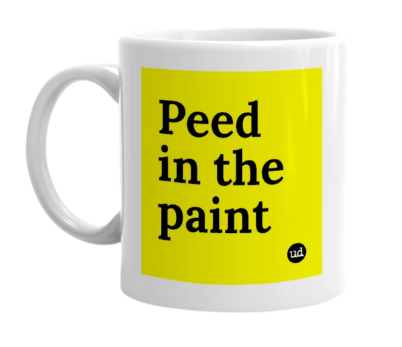 White mug with 'Peed in the paint' in bold black letters