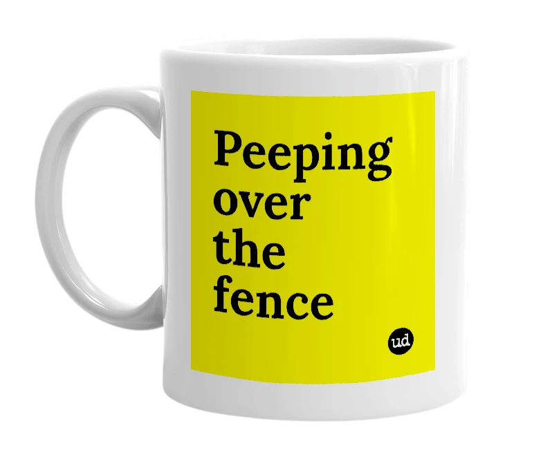 White mug with 'Peeping over the fence' in bold black letters