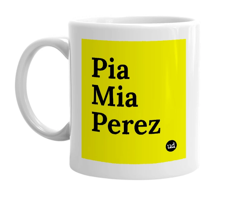 White mug with 'Pia Mia Perez' in bold black letters