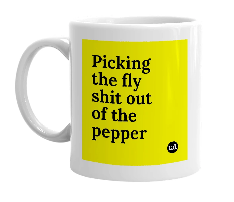 White mug with 'Picking the fly shit out of the pepper' in bold black letters