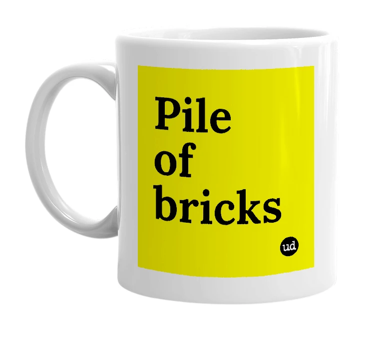 White mug with 'Pile of bricks' in bold black letters