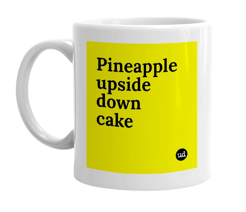 White mug with 'Pineapple upside down cake' in bold black letters