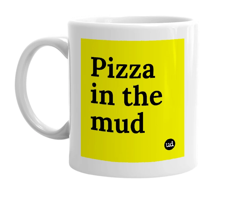 White mug with 'Pizza in the mud' in bold black letters