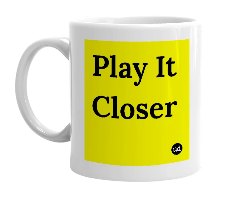 White mug with 'Play It Closer' in bold black letters