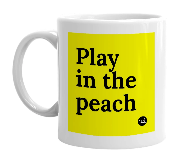 White mug with 'Play in the peach' in bold black letters