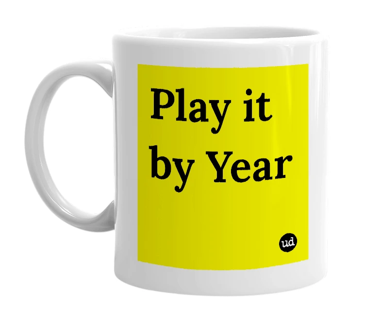White mug with 'Play it by Year' in bold black letters