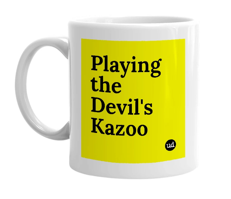 White mug with 'Playing the Devil's Kazoo' in bold black letters